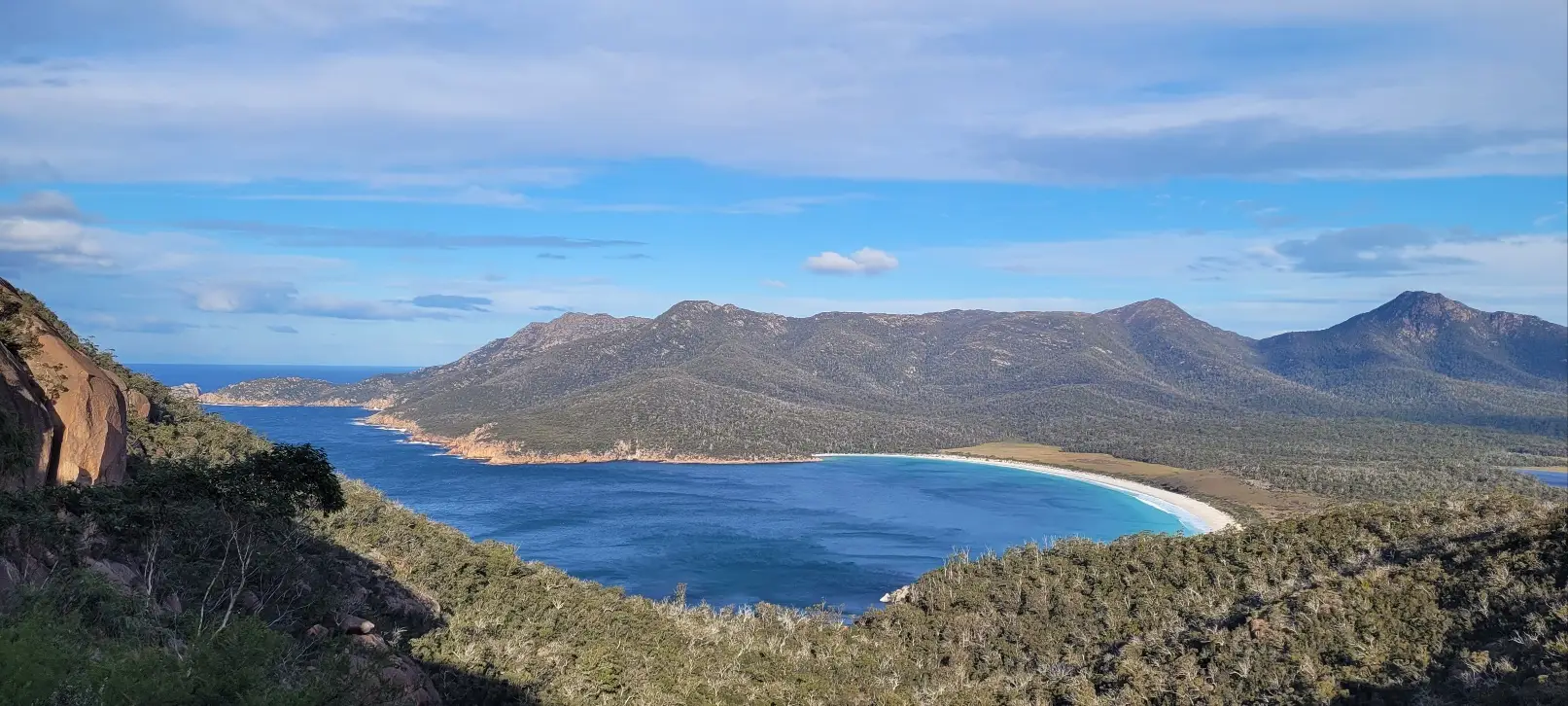 Wide open sea and mountains seen from Mount Tasmania