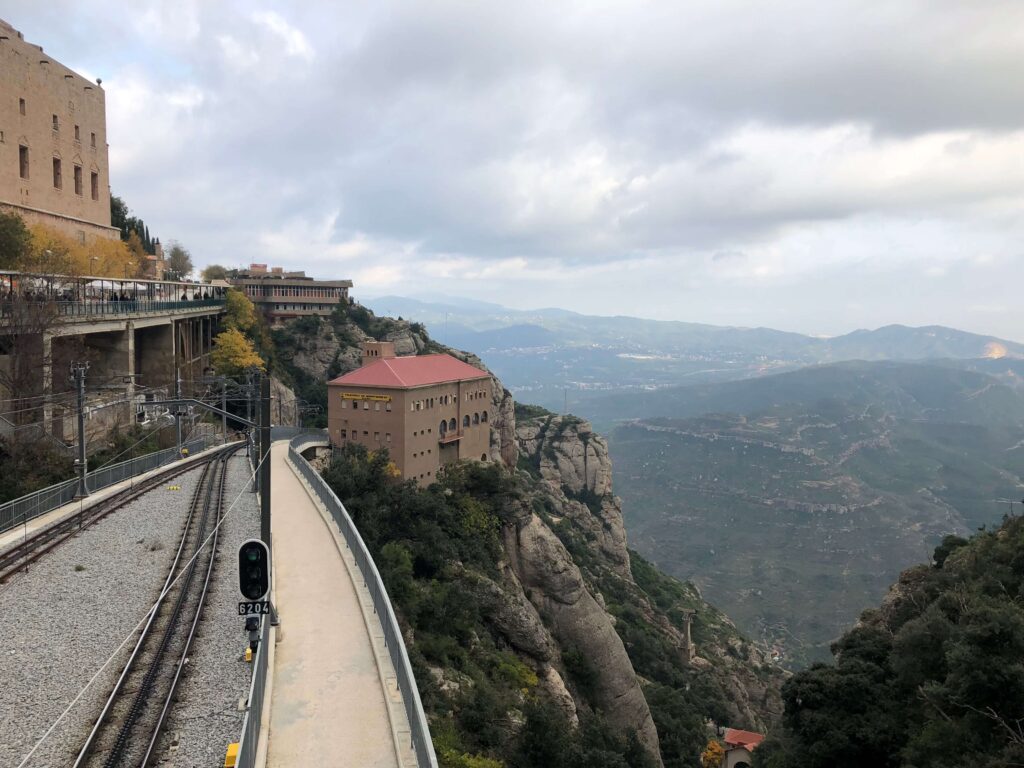 At the Montserrat Monastery in Barcelona with a view of the train rails