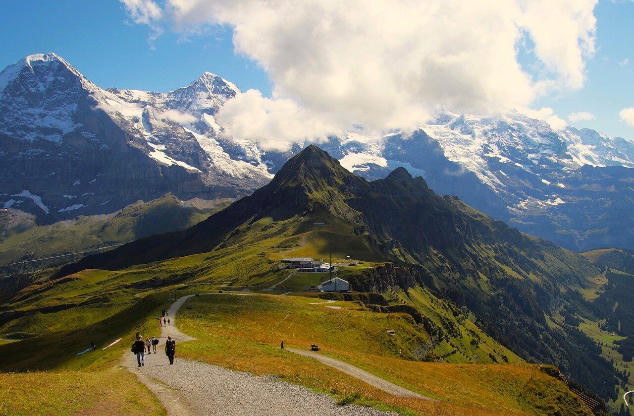 Trekking course with a view of natural snow-covered mountains in the distance