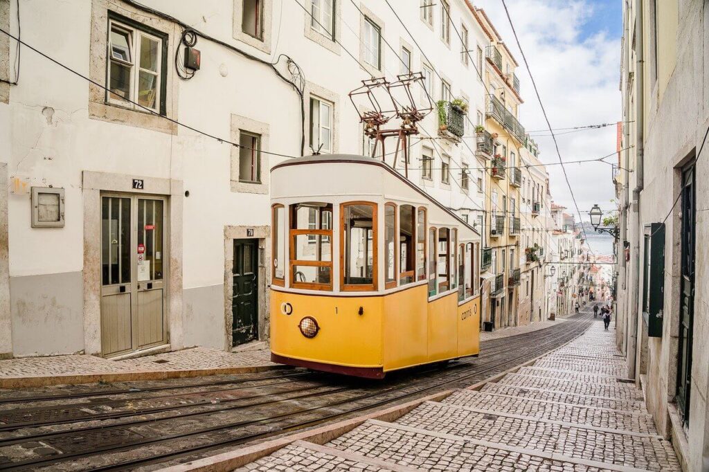 Yellow tram in the alleyways of Lisbon