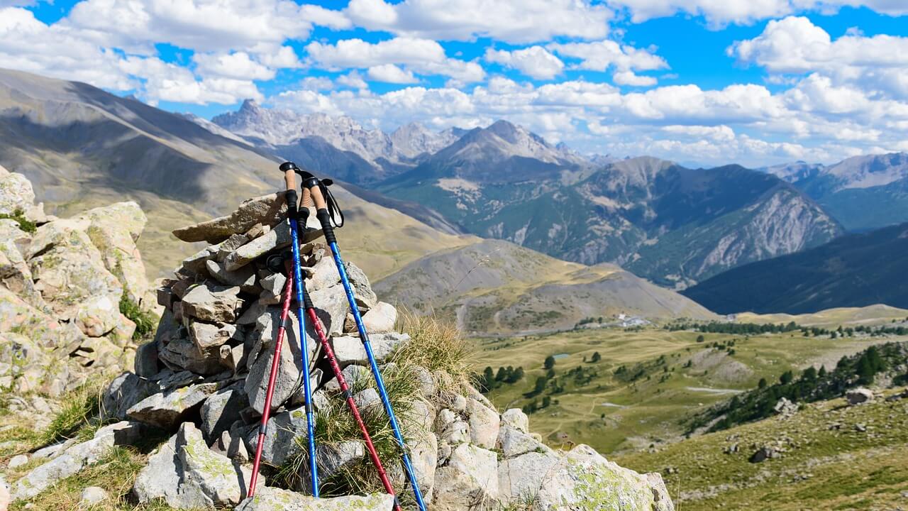 Trekking poles standing on a rocky trekking course