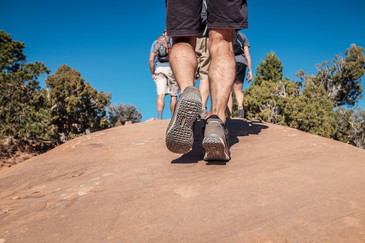 Feet of a person walking in hiking boots