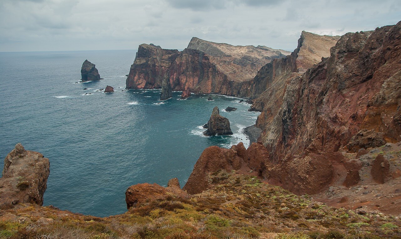 The coast stretched out beneath the cliffs