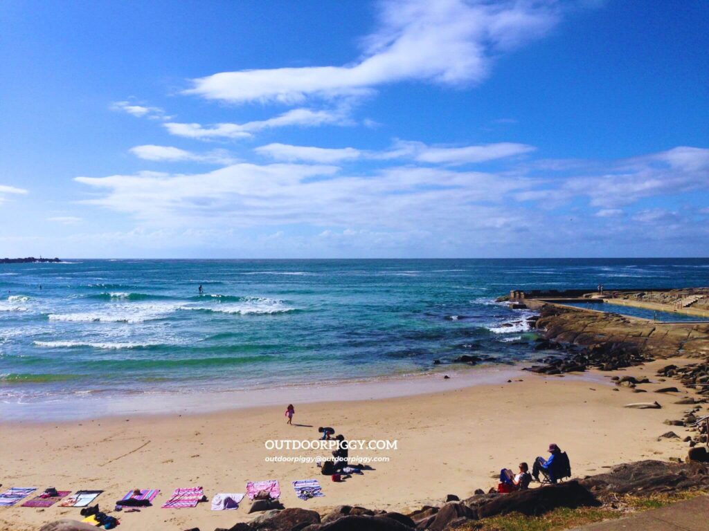 Yamba Beach with many surfers